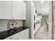 Kitchen area with subway tile backsplash, long countertops, and modern appliances at 1908 Masons Bend Dr, Fort Mill, SC 29708