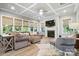Cozy living room with a fireplace, coffered ceiling, and ample seating at 1908 Masons Bend Dr, Fort Mill, SC 29708