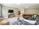 Living room featuring plush furniture, wood flooring, and easy access to the rest of the house at 1908 Masons Bend Dr, Fort Mill, SC 29708