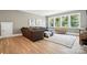 Comfortable living room with natural light, plush sectional sofa, and access to backyard at 1908 Masons Bend Dr, Fort Mill, SC 29708