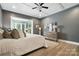 Spacious main bedroom boasts tray ceiling, natural light, wood floors, and ensuite access at 1908 Masons Bend Dr, Fort Mill, SC 29708