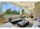 Relaxing covered porch with comfortable seating and outdoor decor at 1908 Masons Bend Dr, Fort Mill, SC 29708