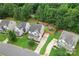 An aerial shot reveals the house nestled among neighboring homes and greenery, highlighting its yard, driveway, and the community setting at 231 Anvil Draw Pl, Rock Hill, SC 29730