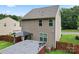 Aerial shot of the backyard featuring a deck, gazebo, outbuilding, and well-maintained landscaping at 231 Anvil Draw Pl, Rock Hill, SC 29730