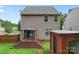 Multi-level deck in a fenced backyard featuring a charming gazebo with curtains and an outbuilding at 231 Anvil Draw Pl, Rock Hill, SC 29730