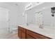 Bright bathroom featuring a double sink vanity, toilet, and shower with white tile surround at 231 Anvil Draw Pl, Rock Hill, SC 29730