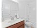 A white bathroom with a vanity, sink, toilet, mirror, and bathtub with shower combo at 231 Anvil Draw Pl, Rock Hill, SC 29730