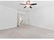 Neutral bedroom with carpet, ceiling fan and staircase access at 231 Anvil Draw Pl, Rock Hill, SC 29730