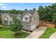 A charming home featuring stone accents, a well-manicured lawn, and an inviting driveway at 231 Anvil Draw Pl, Rock Hill, SC 29730