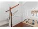 Bright entryway with hardwood floors, white wainscoting, and a staircase with wood banister at 231 Anvil Draw Pl, Rock Hill, SC 29730
