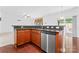 Kitchen showcases granite countertops, stainless steel dishwasher and a breakfast bar at 231 Anvil Draw Pl, Rock Hill, SC 29730