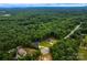 An aerial view of houses amongst a luscious green tree line at 236 Mark Ryan Ln, Dallas, NC 28034