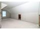 Expansive attic area features a window, providing natural light, ready to be transformed at 236 Mark Ryan Ln, Dallas, NC 28034
