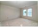 Well-lit bedroom with large windows offers a bright space, ready for personalization at 236 Mark Ryan Ln, Dallas, NC 28034