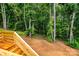 View of deck stairs with tree line at 236 Mark Ryan Ln, Dallas, NC 28034
