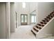 Open foyer featuring a grand staircase and decorative front doors, ready for your personal design at 236 Mark Ryan Ln, Dallas, NC 28034