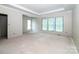 Unfinished living room showcasing large windows and potential for a bright and airy space at 236 Mark Ryan Ln, Dallas, NC 28034
