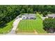 Aerial view showcasing a lush yard, a charming white home, and landscaped grounds at 250 Wesley Amaker Rd, York, SC 29745