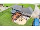 Aerial view of a home with a large deck, fire pit area, and lush green lawn at 250 Wesley Amaker Rd, York, SC 29745