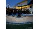 Well-lit backyard with a fire pit area and a wooden deck for outdoor gatherings at 250 Wesley Amaker Rd, York, SC 29745