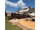 Multi-tiered deck with backyard fire pit and seating area for outdoor entertaining at 250 Wesley Amaker Rd, York, SC 29745