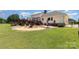 Expansive backyard with a deck, fire pit area, and well-maintained lawn at 250 Wesley Amaker Rd, York, SC 29745