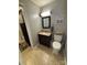 Clean bathroom features a granite vanity, framed mirror, with a shower and toilet at 250 Wesley Amaker Rd, York, SC 29745