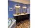 A spacious bathroom with double sinks, mirrors, and a tub at 250 Wesley Amaker Rd, York, SC 29745