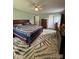 Spacious bedroom featuring a ceiling fan and unique rug design at 250 Wesley Amaker Rd, York, SC 29745