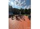 Expansive deck with seating, table, shed, and picturesque backyard views under sunny skies at 250 Wesley Amaker Rd, York, SC 29745