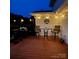Inviting deck with wooden furniture and ambient lighting for relaxed evenings at 250 Wesley Amaker Rd, York, SC 29745
