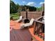 Relaxing deck area with seating and lush green backyard, for serene lounging at 250 Wesley Amaker Rd, York, SC 29745