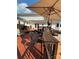 Multi-level wooden deck with chairs, grill, umbrella, and stairs great for enjoying outdoors at 250 Wesley Amaker Rd, York, SC 29745