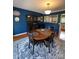 Charming dining area featuring a round table, blue accent wall, and hardwood floors at 250 Wesley Amaker Rd, York, SC 29745