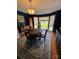 Elegant dining room with a round table, bay window, and classic decor at 250 Wesley Amaker Rd, York, SC 29745