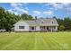 Charming home featuring a landscaped yard, covered porch, and classic architectural details at 250 Wesley Amaker Rd, York, SC 29745