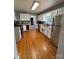 Bright kitchen with stainless steel appliances, white cabinets, and hardwood floors at 250 Wesley Amaker Rd, York, SC 29745