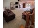 Spacious living room features a brick fireplace, plush seating, and access to the patio at 250 Wesley Amaker Rd, York, SC 29745