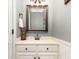 Charming half-bathroom with vanity, framed mirror, and neutral wall color at 254 Charter Se Ct, Concord, NC 28025