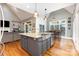 Spacious kitchen with a large island, stainless steel appliances, and plenty of counter space at 254 Charter Se Ct, Concord, NC 28025