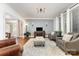 Cozy living room with a plush rug, comfortable seating, and stylish decor at 254 Charter Se Ct, Concord, NC 28025