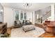 Bright and airy living room with large windows, neutral tones, and hardwood floors at 254 Charter Se Ct, Concord, NC 28025