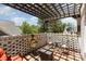 Outdoor patio with brick floors, brick walls, and a pergola overhead for a shaded seating area at 254 Charter Se Ct, Concord, NC 28025