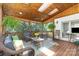 Inviting screened porch featuring wood ceiling, skylights, and comfortable wicker seating at 254 Charter Se Ct, Concord, NC 28025