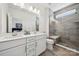 Modern bathroom with double vanity, sleek fixtures, a glass-enclosed shower, and contemporary tile work at 4148 Alexander View Dr, Charlotte, NC 28226