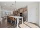 Bright kitchen with a large island, stainless steel refrigerator, and gray cabinets, perfect for modern living at 4148 Alexander View Dr, Charlotte, NC 28226