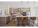 Stylish kitchen with gray cabinets, stainless steel appliances, a large island, pendant lighting, and bar stool seating at 4148 Alexander View Dr, Charlotte, NC 28226