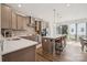 Open kitchen with stainless steel appliances, white countertops, pendant lighting, and hardwood flooring at 4148 Alexander View Dr, Charlotte, NC 28226