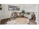 Spacious office with rustic desk, modern sofa, stylish decor, and dark wood-look flooring at 4148 Alexander View Dr, Charlotte, NC 28226