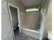 Cozy tub/shower with window, next to the toilet at 4221 Hounds Run Dr, Matthews, NC 28105
